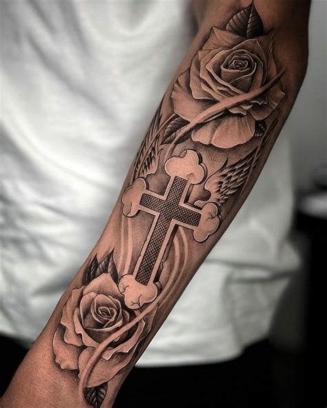 rose and cross forearm tattoo